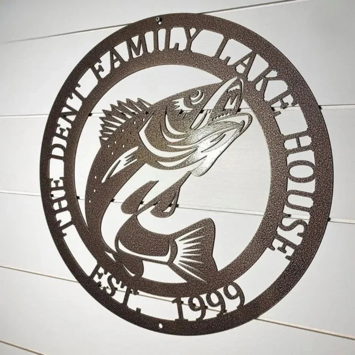 Custom family lake house fish metal sign with established year on white shiplap wall