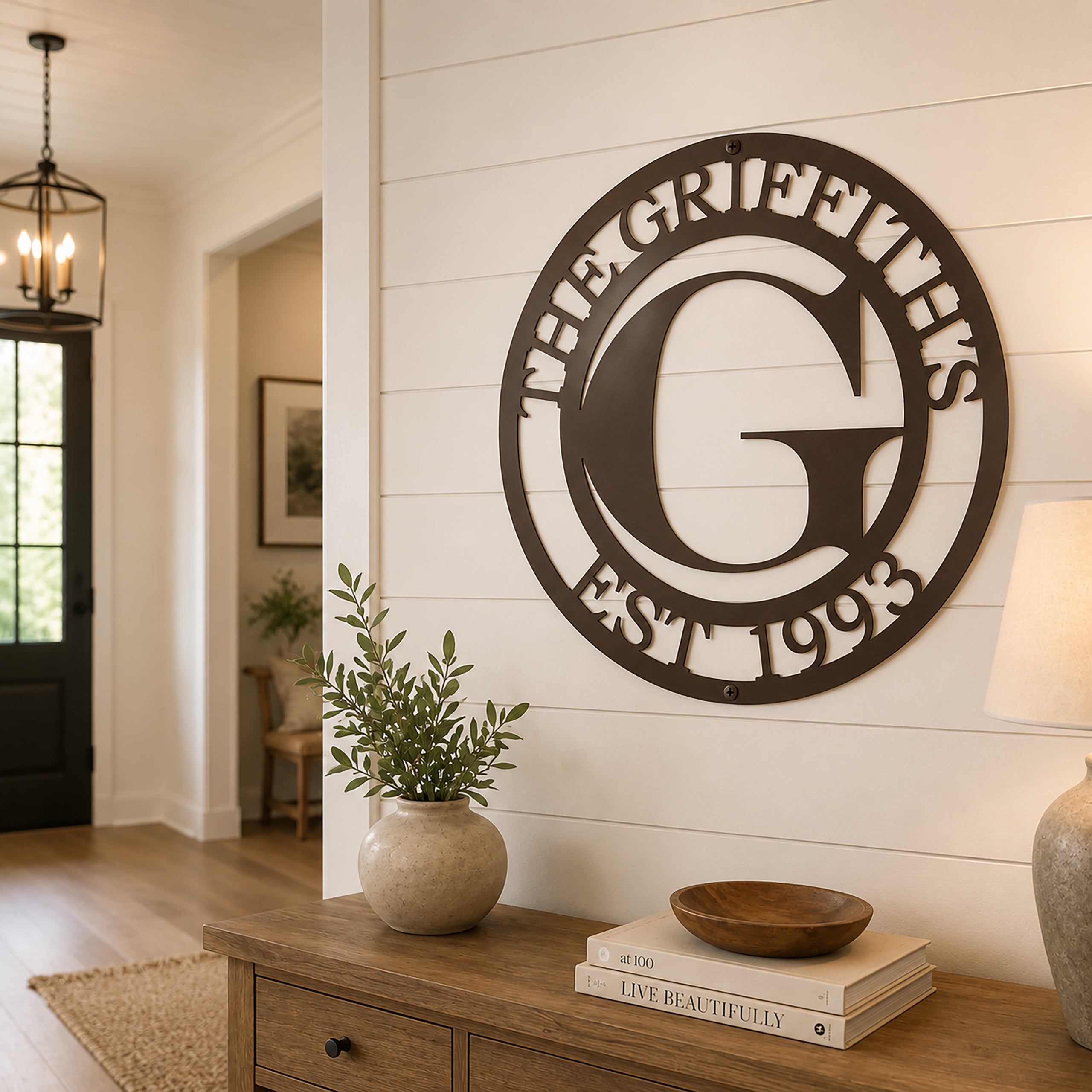 Custom family monogram metal sign — personalized espresso last name wall decor featuring a custom initial, family name, and established year displayed on a farmhouse shiplap accent wall.