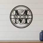 Custom family monogram metal sign — personalized last name monogram decor featuring a decorative circular design mounted on a modern shiplap wall.