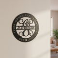 Custom Satin Black family monogram metal sign featuring children’s names, family surname, and established date mounted on an elegant interior wall.