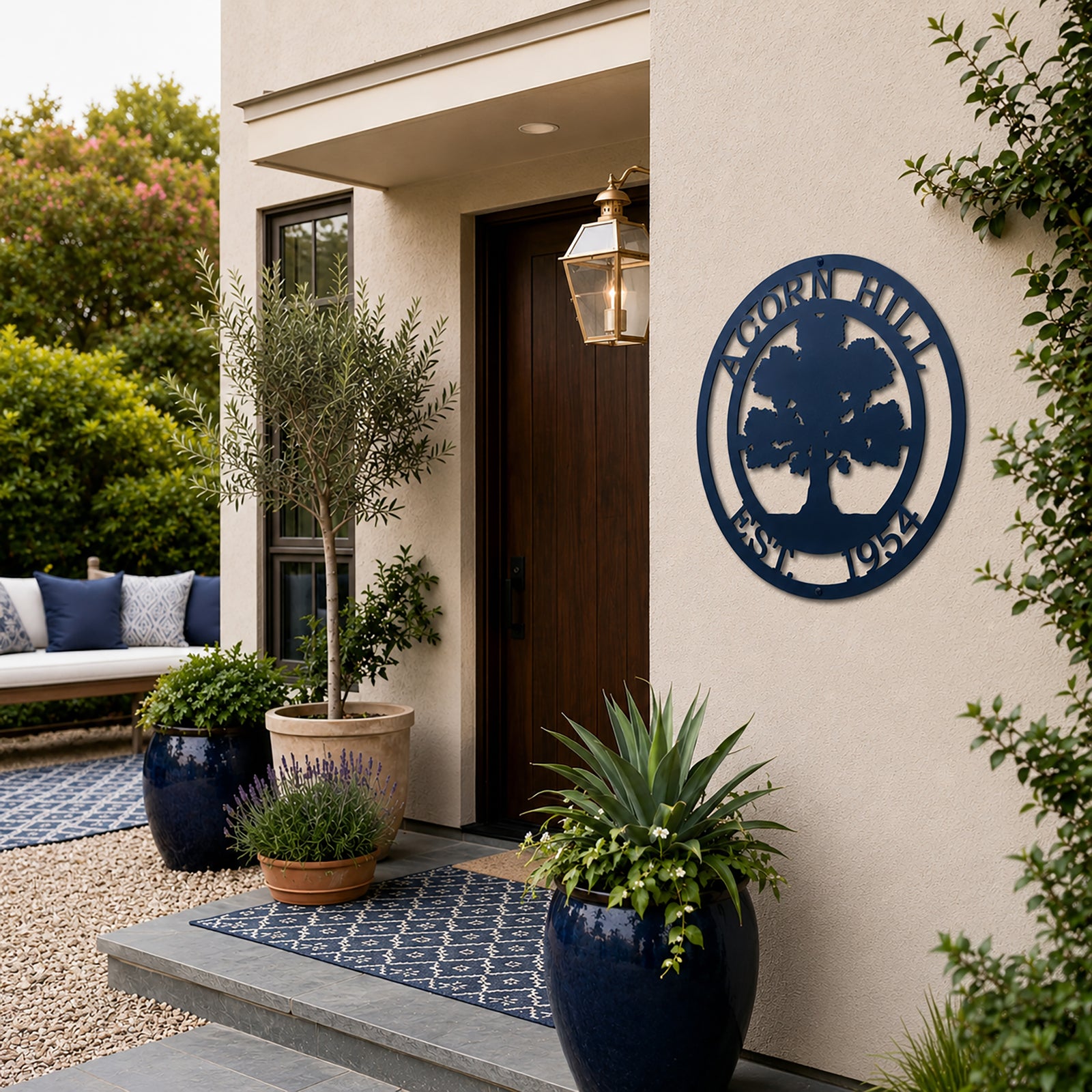 Navy blue oak tree family name metal sign displayed beside modern front door