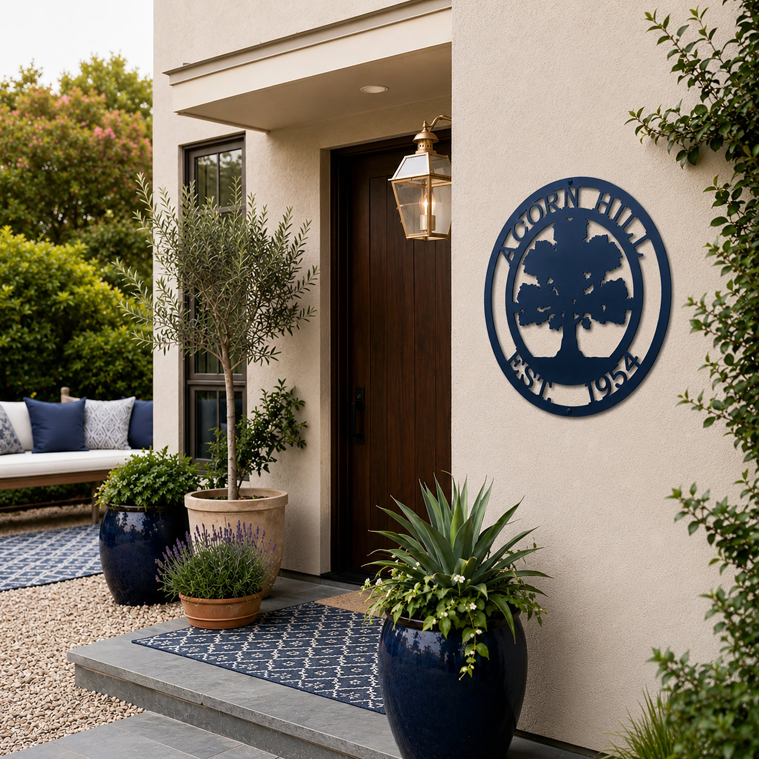 Navy blue oak tree family name metal sign displayed beside modern front door