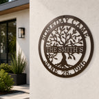 Custom family tree metal sign — personalized espresso established family wall art displayed on an exterior stucco wall of a modern home.
