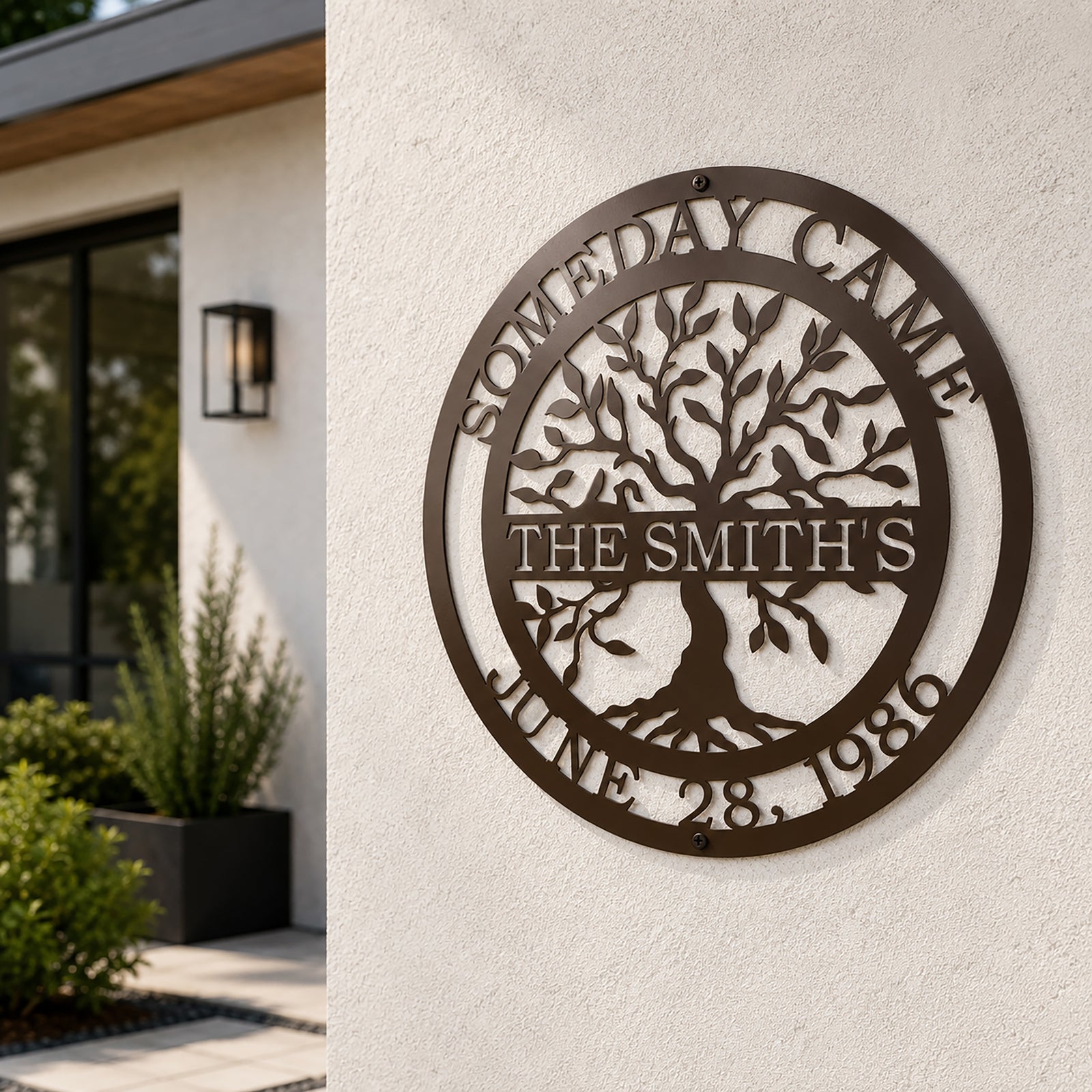 Custom family tree metal sign — personalized espresso established family wall art displayed on an exterior stucco wall of a modern home.