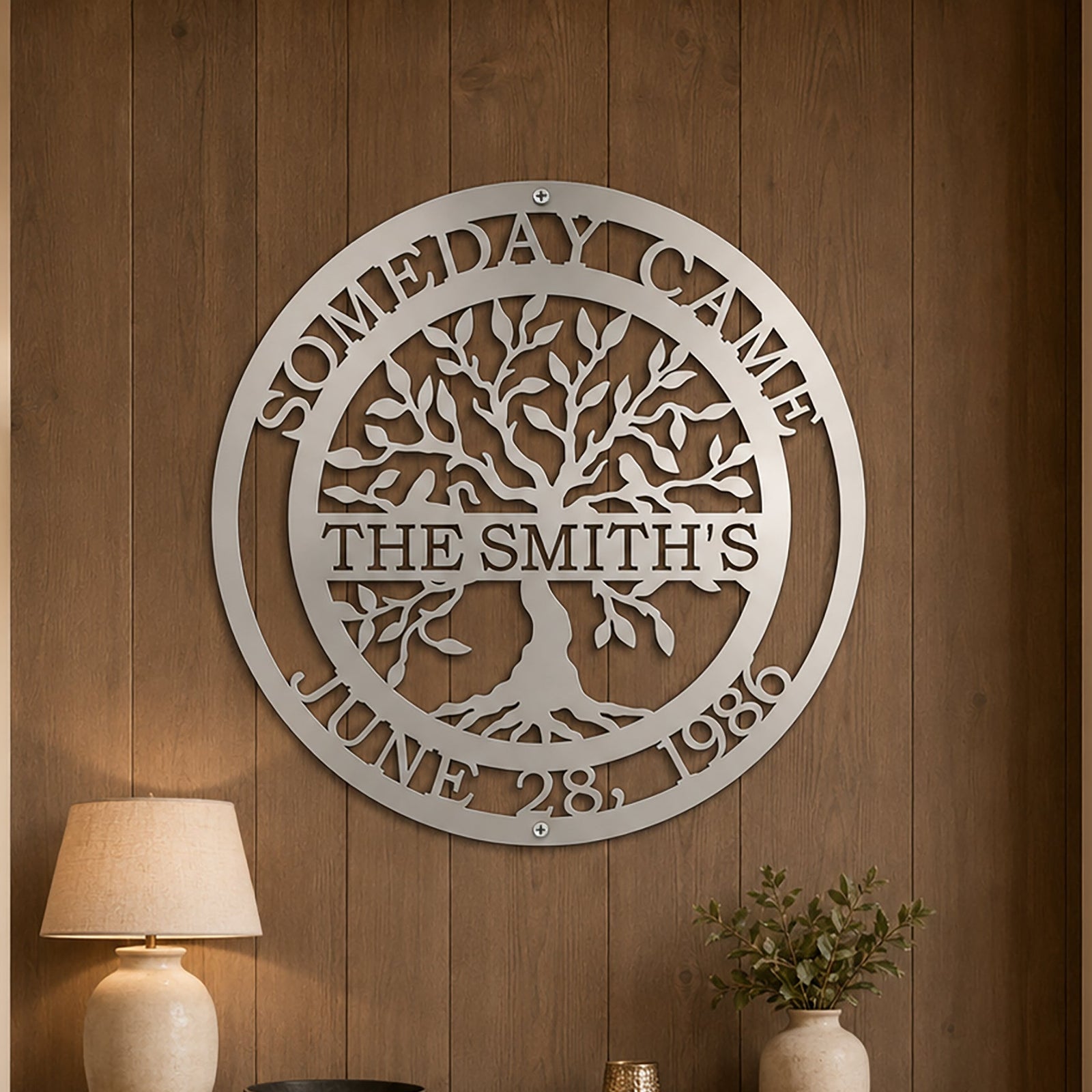 Custom family tree metal sign — personalized satin titanium family name wall art displayed on an elegant interior wall with inspirational home décor accents.