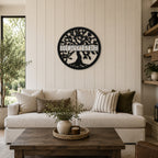 Personalized black tree of life metal wall decor with custom family name displayed above neutral farmhouse living room sofa