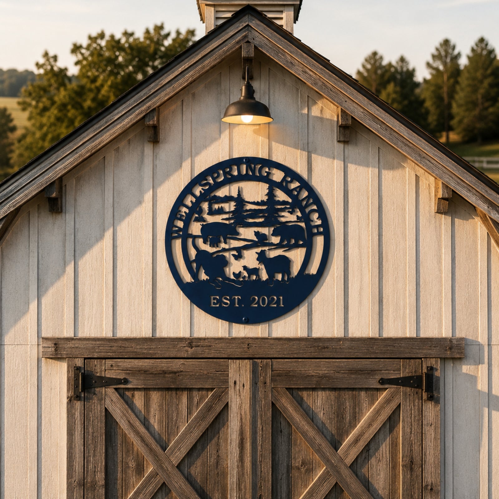 Round navy blue ranch metal wall art mounted above rustic barn doors with personalized ranch name and established year