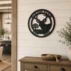 Black deer silhouette metal wall sign with custom farm name mounted above rustic farmhouse console table