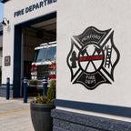 Black firefighter metal wall decor with custom Pickford Johnson design mounted outside modern fire department station