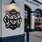 Personalized fire rescue Maltese cross metal wall sign displayed outside active fire department station beside emergency vehicle