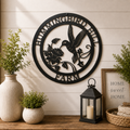 Personalized hummingbird farm metal wall décor with floral accents displayed above wooden table with lantern and plants