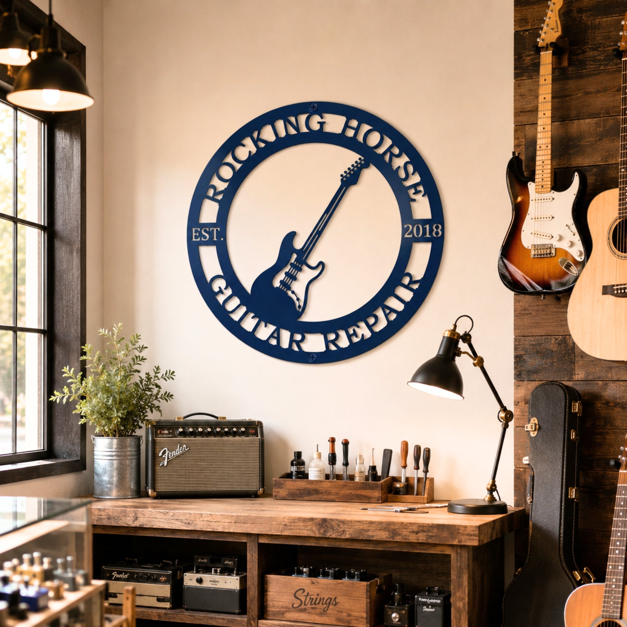 Blue custom guitar repair metal wall sign displayed in modern music workshop with guitars amps and rustic wooden décor