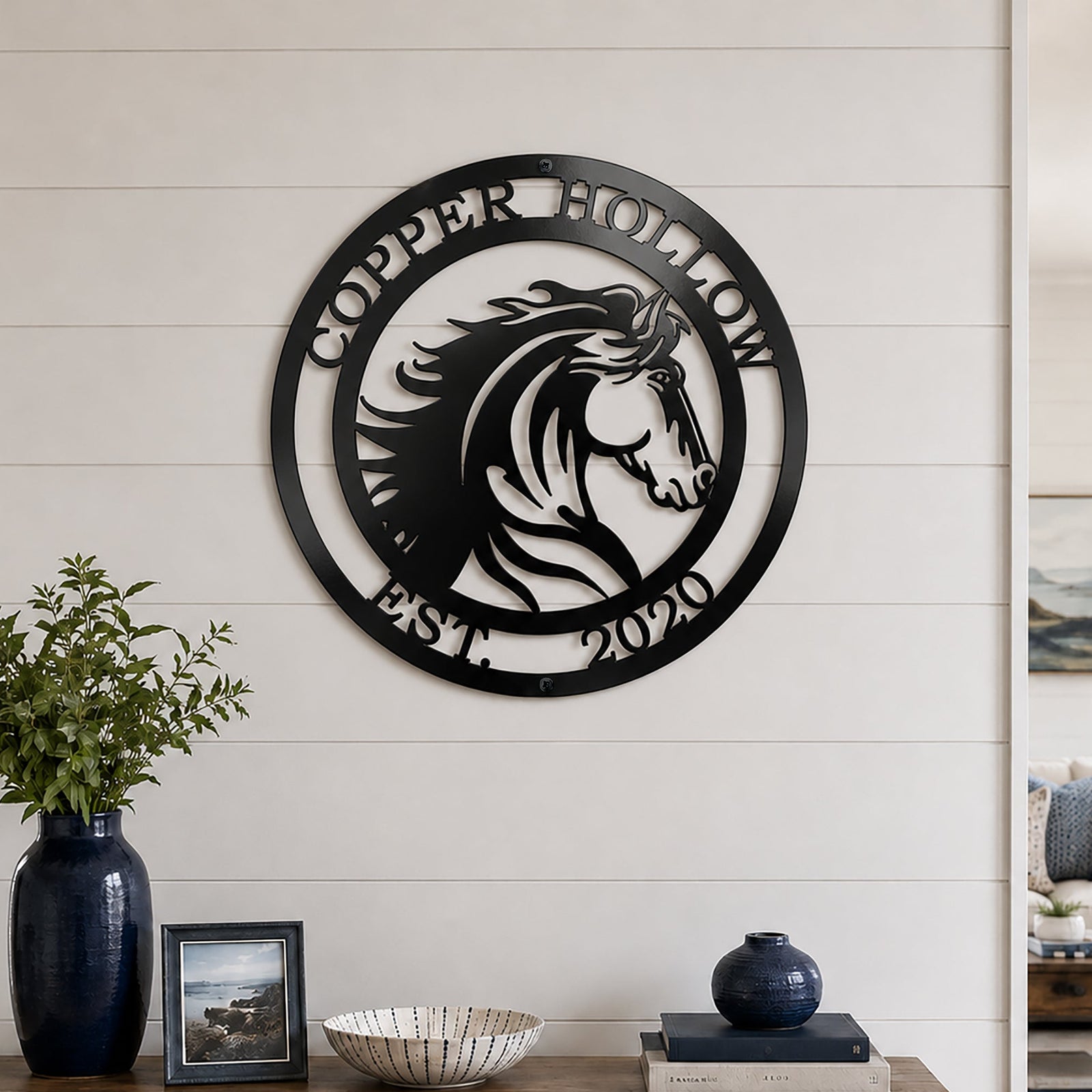 Black custom horse metal sign displayed above wooden console table in farmhouse home