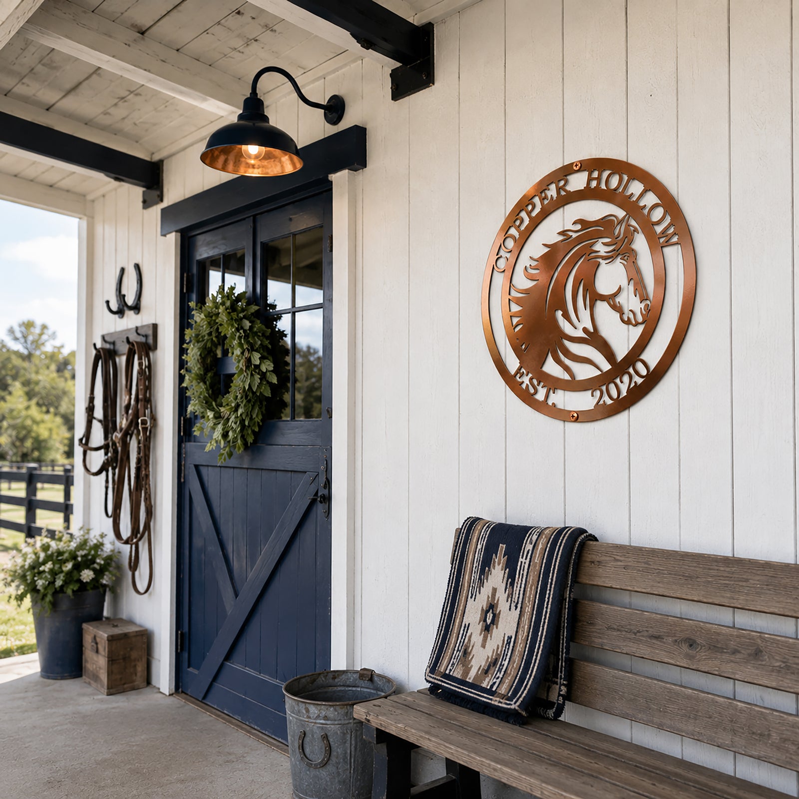 Copper custom horse metal sign mounted on white barn wall near rustic bench