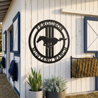 Black custom Mustang Ranch horse metal sign displayed on white barn wall with stable decor