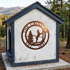 Tuscan copper horse ranch metal sign displayed on rustic outdoor shelter with mountain cabin background