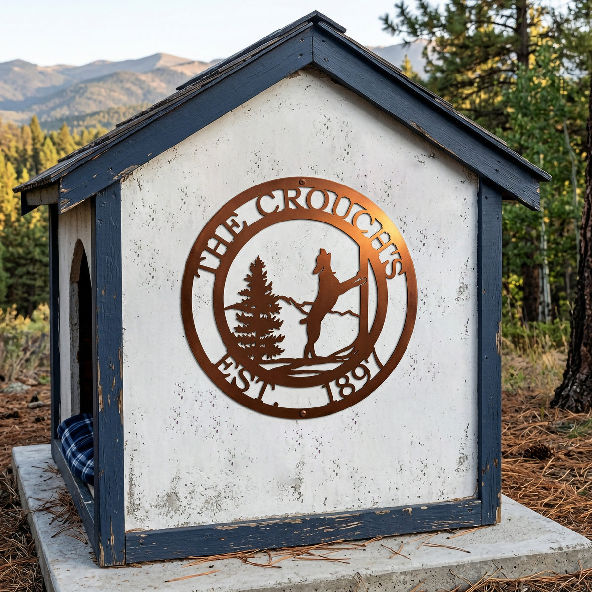 Tuscan copper horse ranch metal sign displayed on rustic outdoor shelter with mountain cabin background