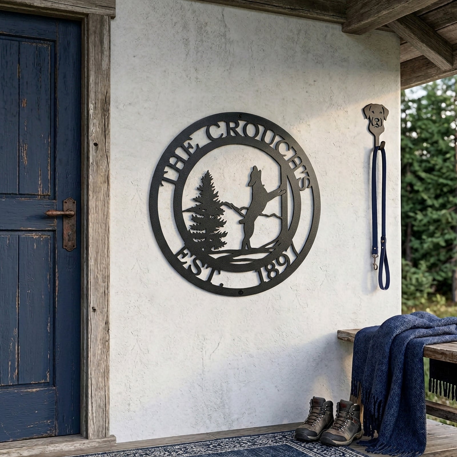 Satin black horse stable metal wall sign displayed beside rustic blue door with leash holder decor