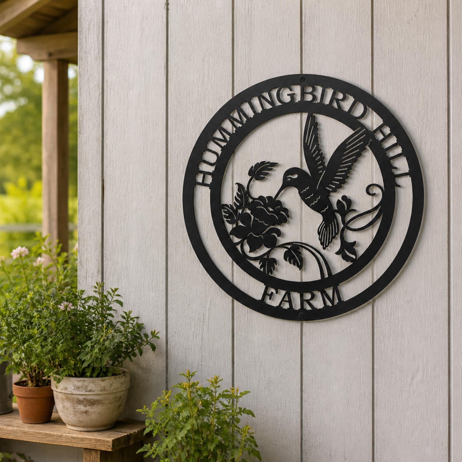 Personalized hummingbird hill farm metal sign mounted on white outdoor wall with floral design and farmhouse porch décor