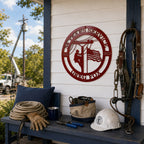 Red custom lineman service metal wall sign displayed on rustic porch with utility tools