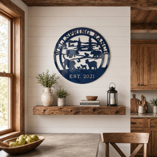 Round navy blue ranch metal wall décor with custom ranch name and EST 2021 displayed above wooden floating shelf in farmhouse kitchen