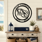 Black lobster metal wall sign with The Lloyds and Est 2022 displayed above coastal console table and nautical decor