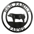 Custom round metal pig farm sign featuring the text B&B Family Farms laser-cut in black powder-coated steel with a hog silhouette in the center, isolated on a white background.