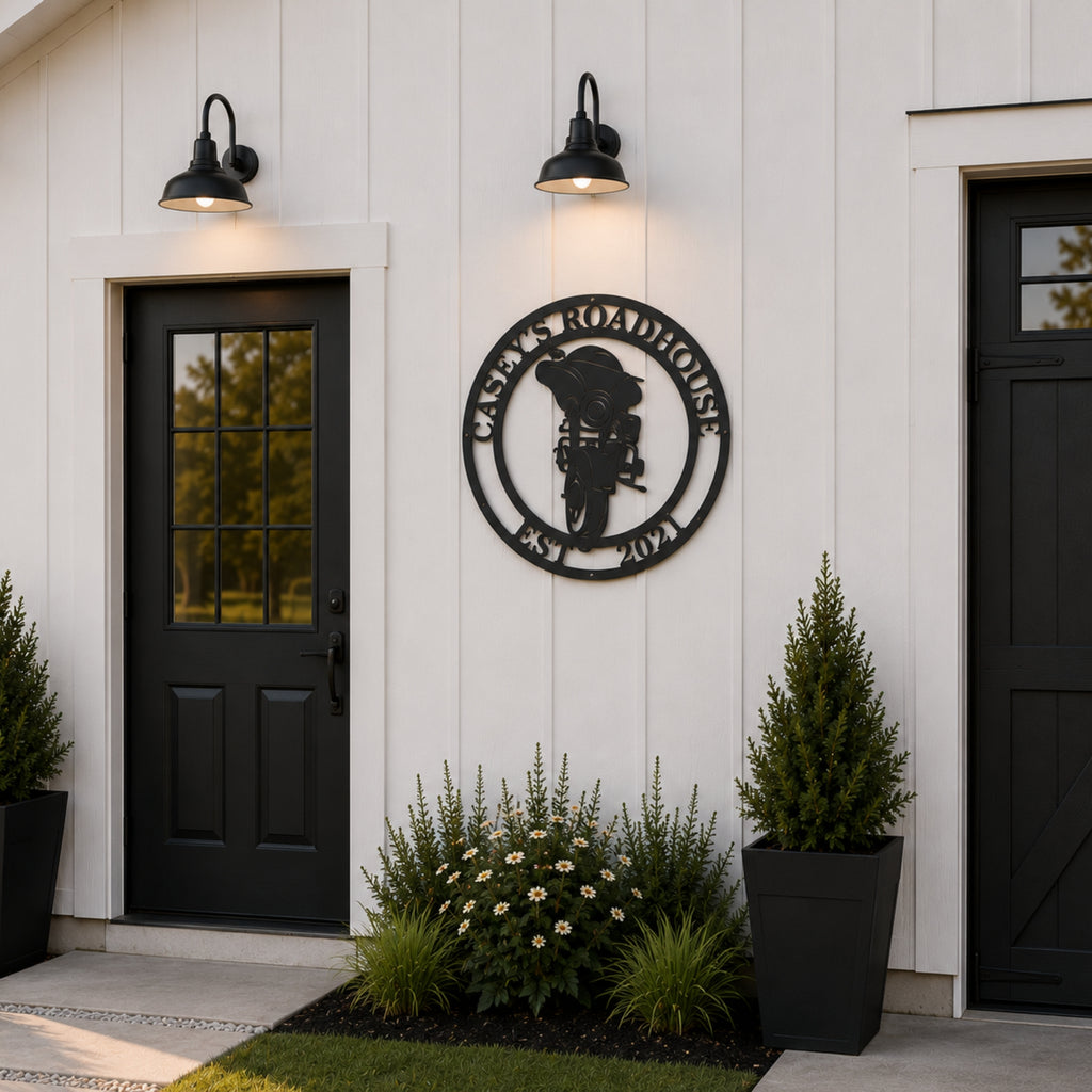 Personalized motorcycle metal wall sign with custom roadhouse name mounted on modern farmhouse exterior wall