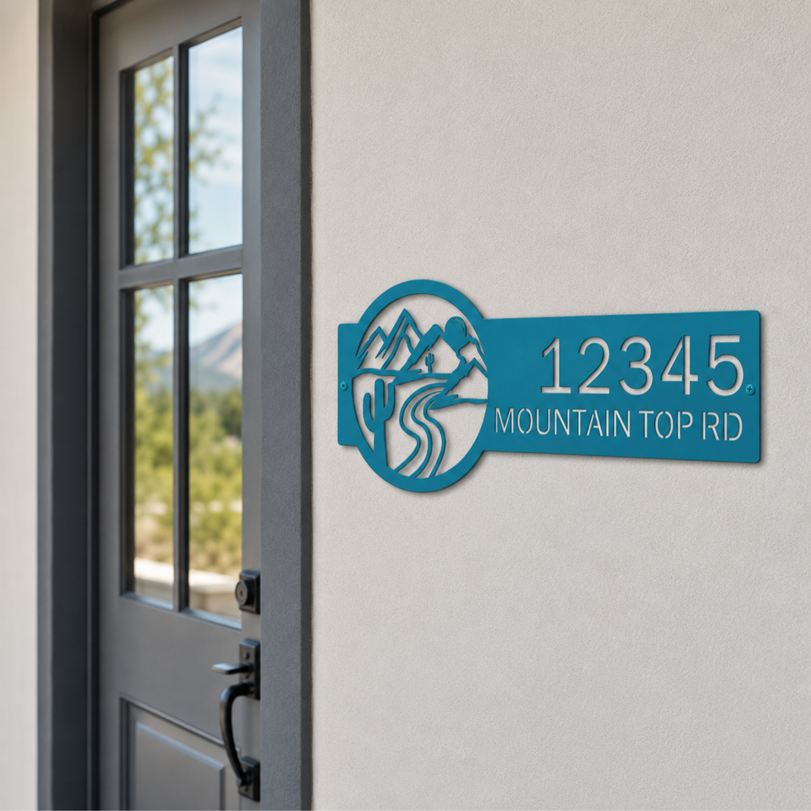 Turquoise custom mountain address sign with desert cactus and road design on entry wall