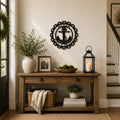 Personalized anchor monogram metal wall sign displayed above a wooden bench with modern farmhouse porch décor and potted plants