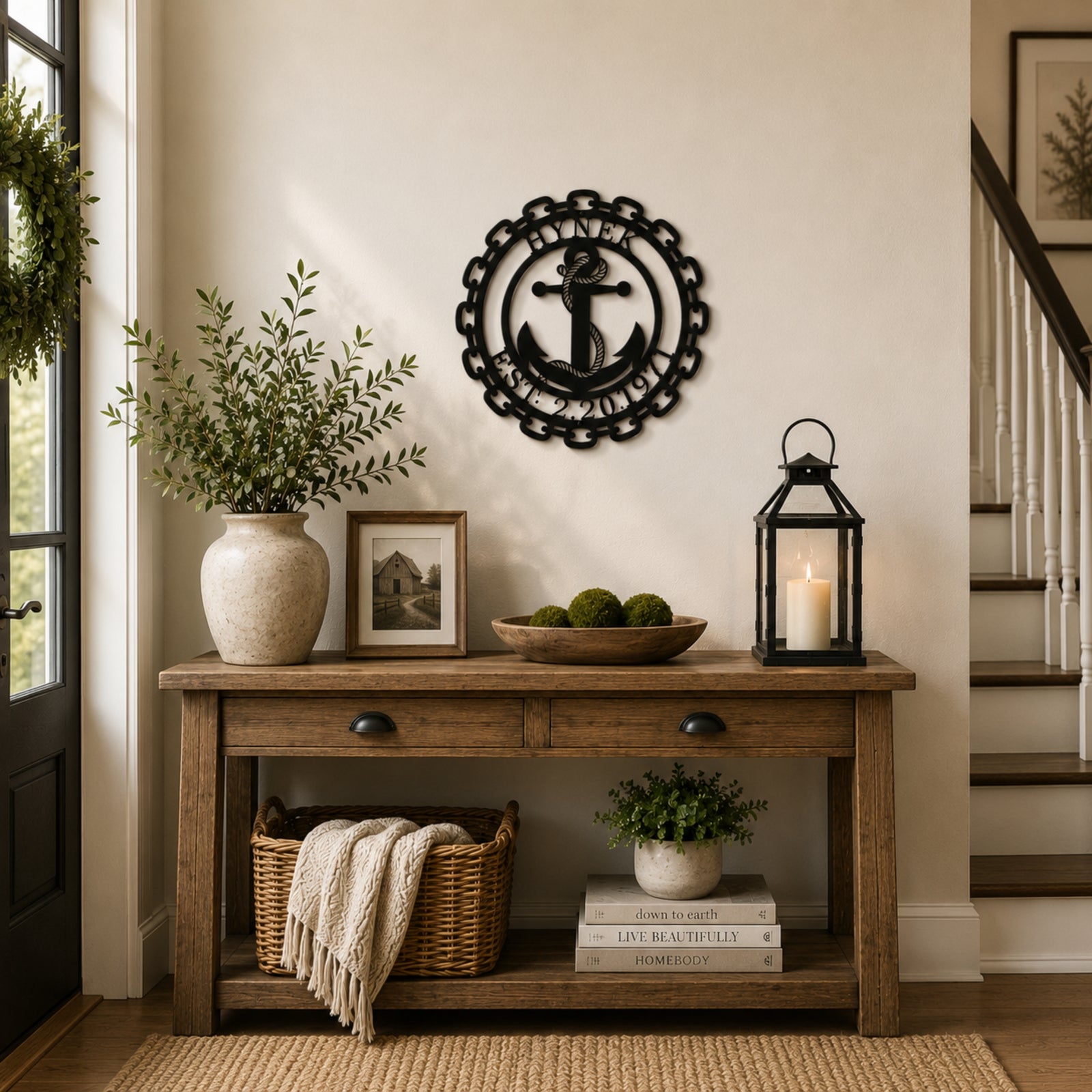 Personalized anchor monogram metal wall sign displayed above a wooden bench with modern farmhouse porch décor and potted plants