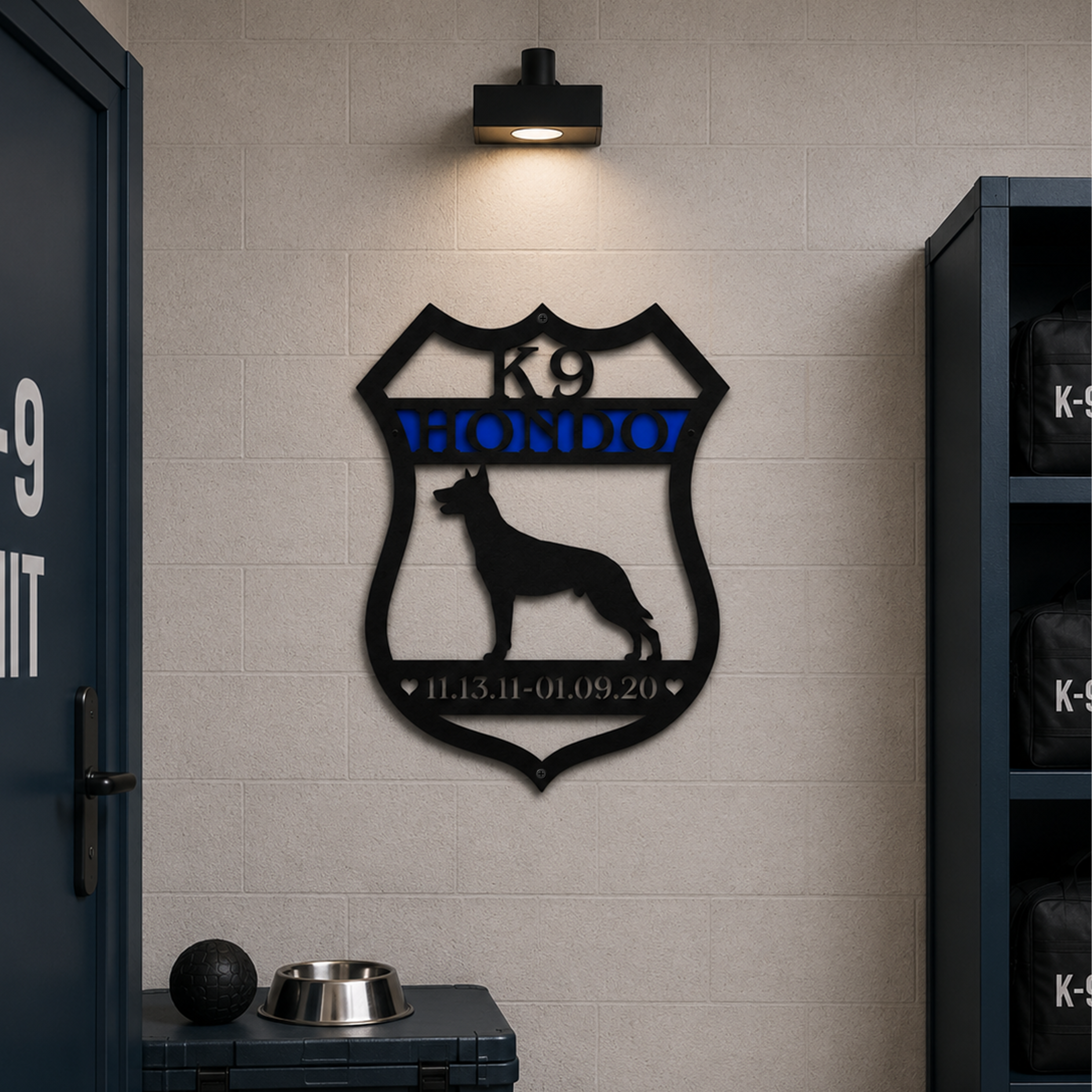 Personalized K9 Hondo badge metal wall art displayed in police K9 unit room with gear storage