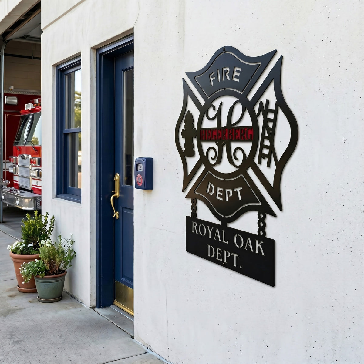 Firefighter themed personalized metal wall sign mounted outside station entrance with fire truck and modern exterior