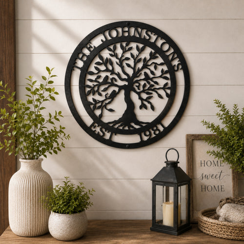 Personalized Tree of Life metal family name sign displayed above a rustic console table