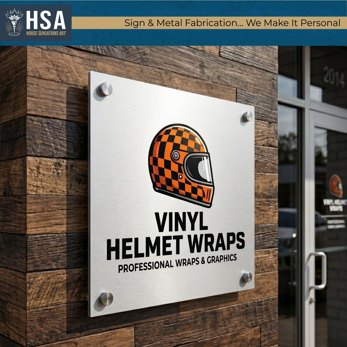 Brushed metal business sign for vinyl helmet wraps mounted on rustic wood storefront wall with racing helmet logo