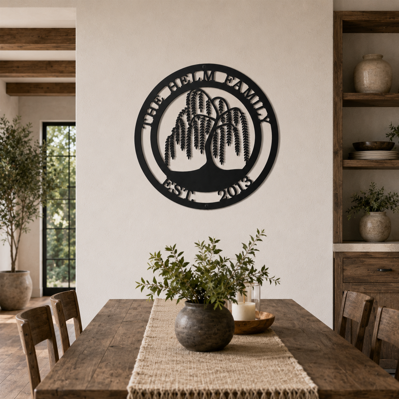 Custom weeping willow tree metal sign — personalized established family wall art mounted above a rustic farmhouse dining room table.