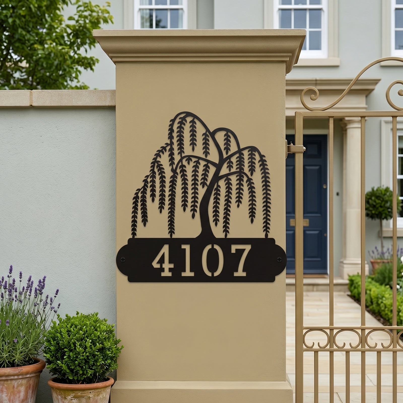 Elegant black willow tree metal address sign mounted on exterior gate pillar with modern home background