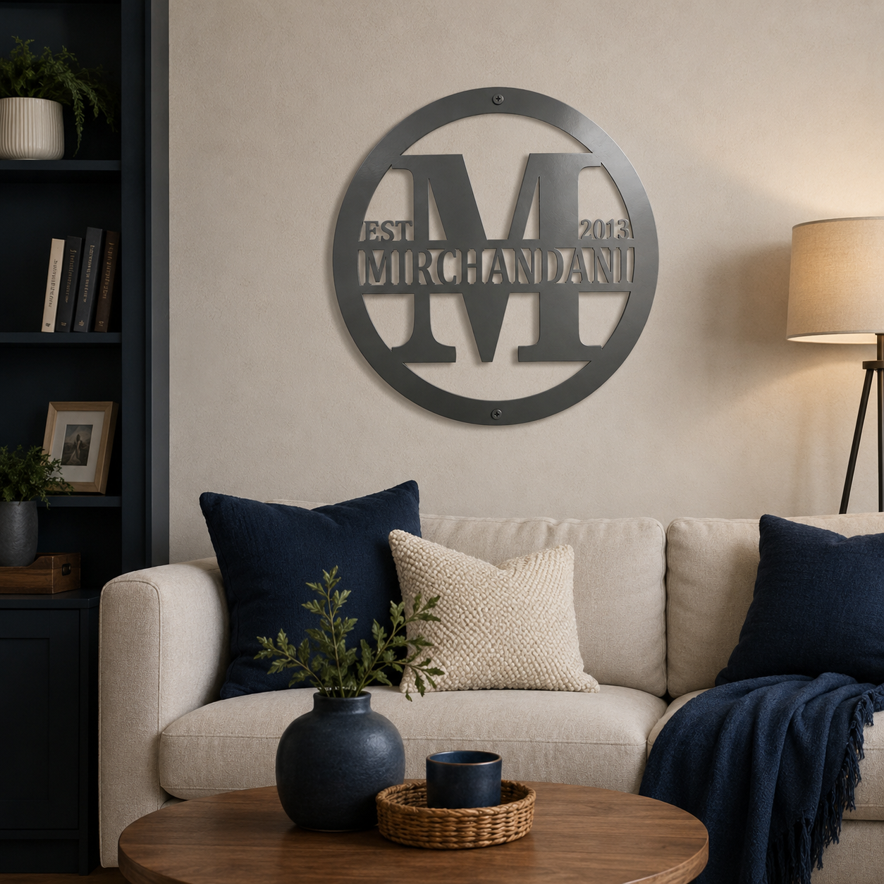 Black custom family monogram metal wall sign displayed above a beige living room sofa