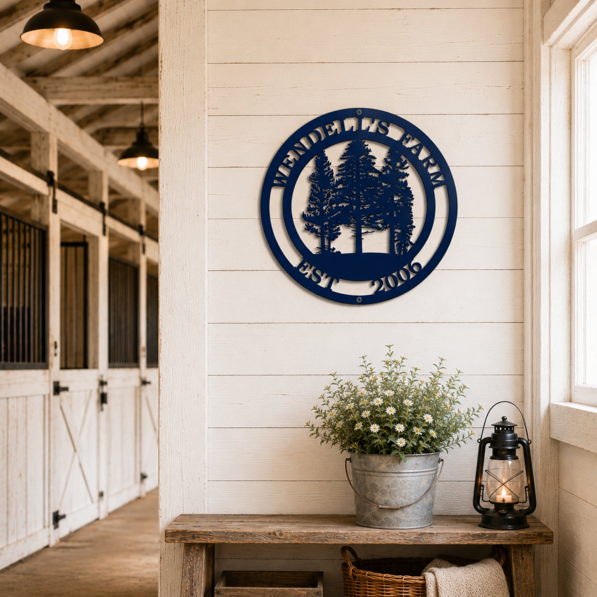 Round navy blue ranch metal wall art mounted above rustic barn doors with personalized ranch name and established year