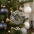 Personalized fire department ornament with firefighter themed design displayed on elegant Christmas tree with glowing lights and ornaments