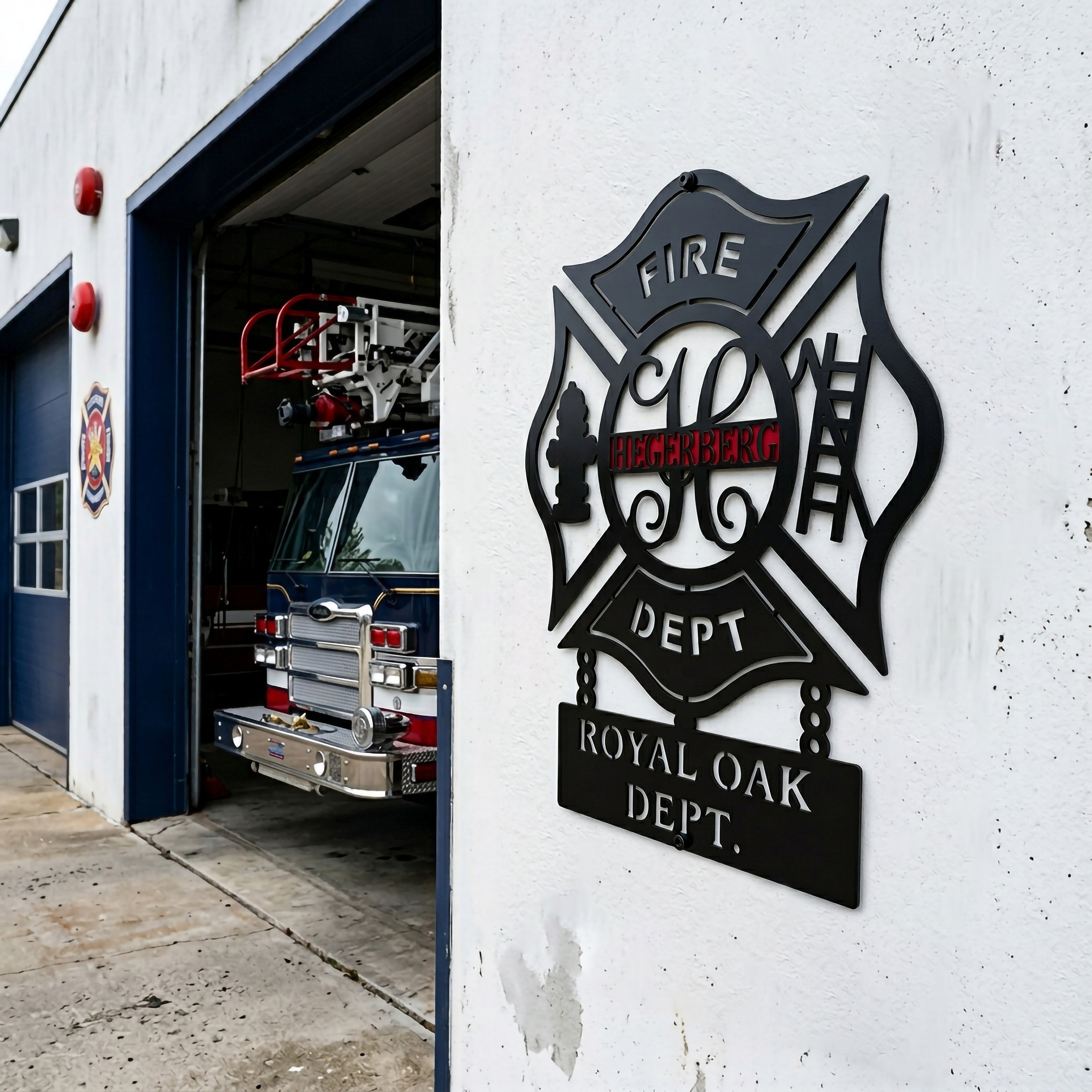 Custom firefighter maltese cross metal wall sign mounted outside fire station with fire truck in garage background