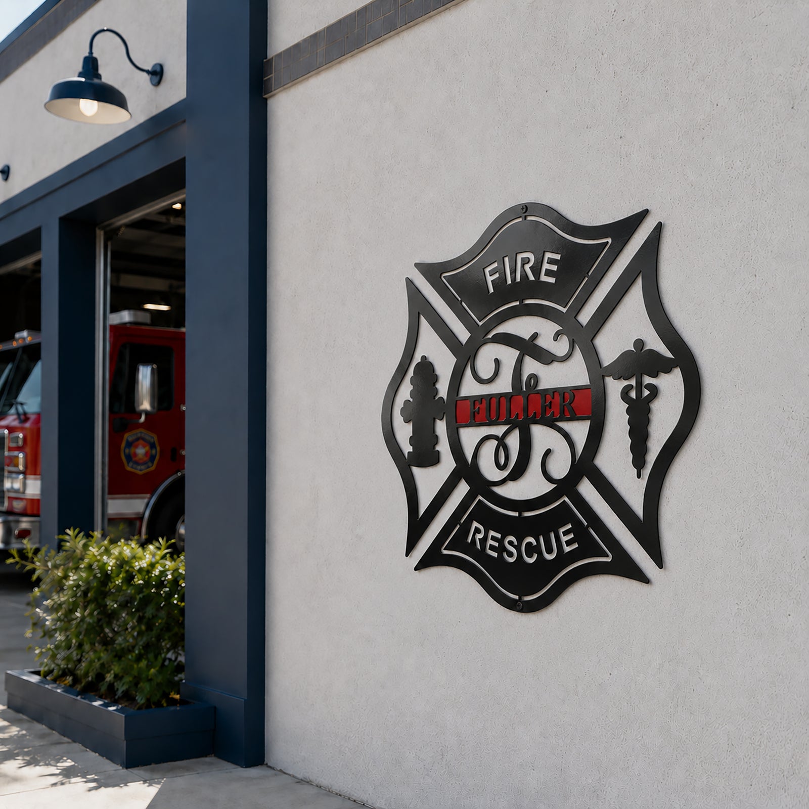 Custom fire rescue metal wall sign displayed outside fire station building with fire truck and modern exterior lighting