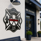 Personalized firefighter maltese cross wall art mounted outside fire department entrance with modern exterior lighting