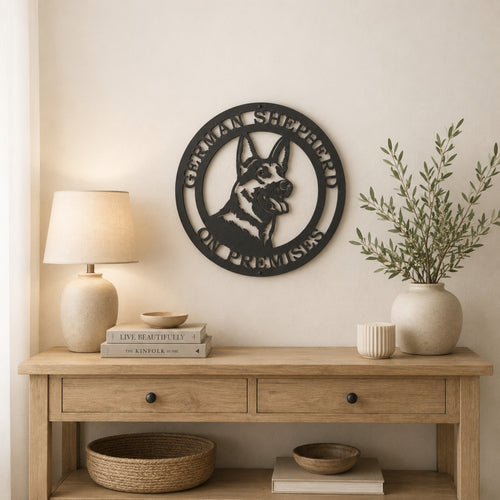 Black German Shepherd on premises metal wall sign displayed above wooden console table with neutral farmhouse decor
