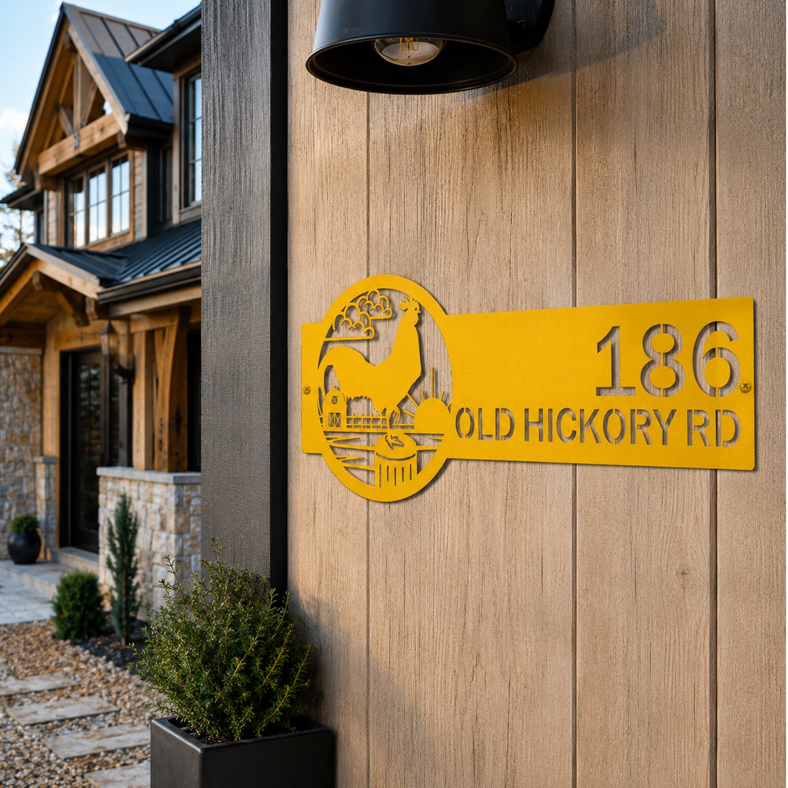 Golden yellow rooster metal address sign mounted on wood siding with custom house number and old hickory road text rustic farmhouse outdoor decor