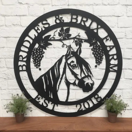 Grapevine Horse Ranch Sign displayed on a shelf, featuring a metal design with a horse and grapes. Ideal for outdoor decor in gardens, yards, or farms; perfect housewarming gift for animal lovers.