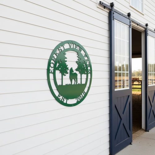 Green Forest View Farm metal wall sign with horse and trees displayed on a white porch wall overlooking pasture and barn