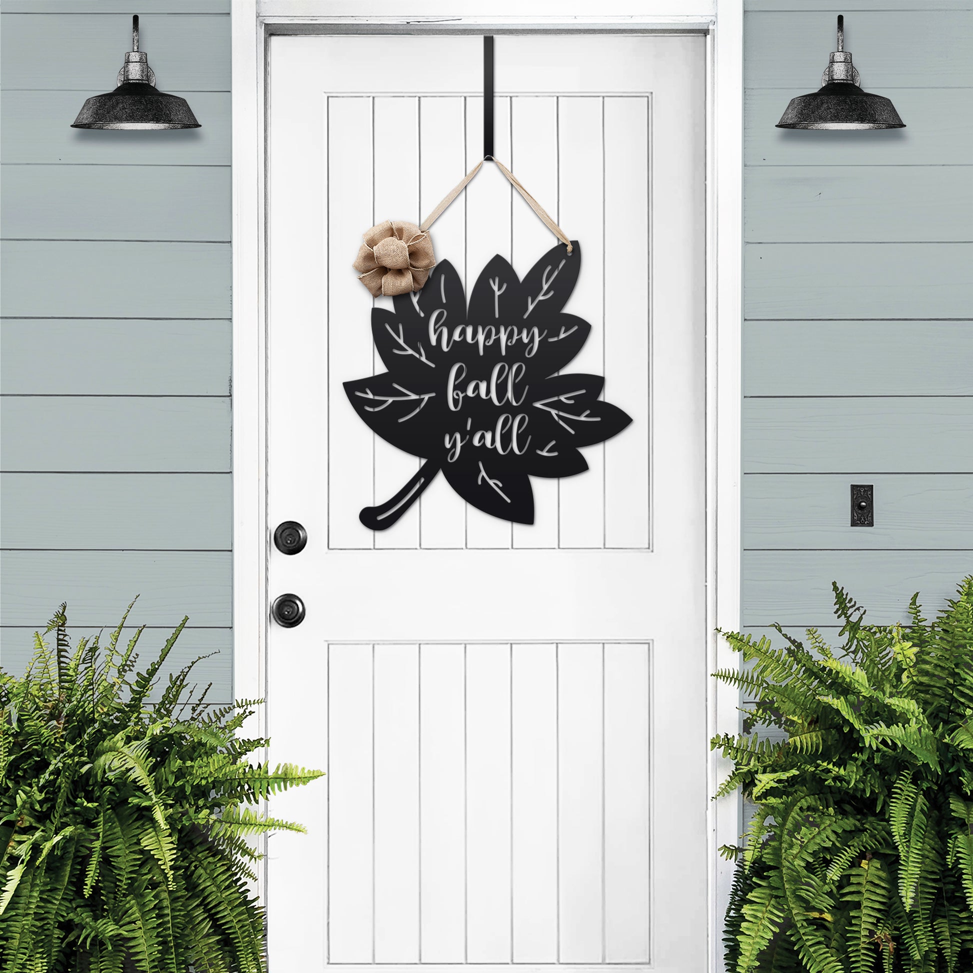 Happy Fall Y'all Metal Leaf Door Wreath featuring a black leaf with white text and a burlap bow, perfect for customizing your home decor with a rustic, seasonal welcome.