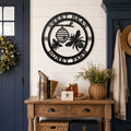 Black honey bee metal wall sign above farmhouse entryway table decor