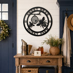Black honey bee metal wall sign above farmhouse entryway table decor